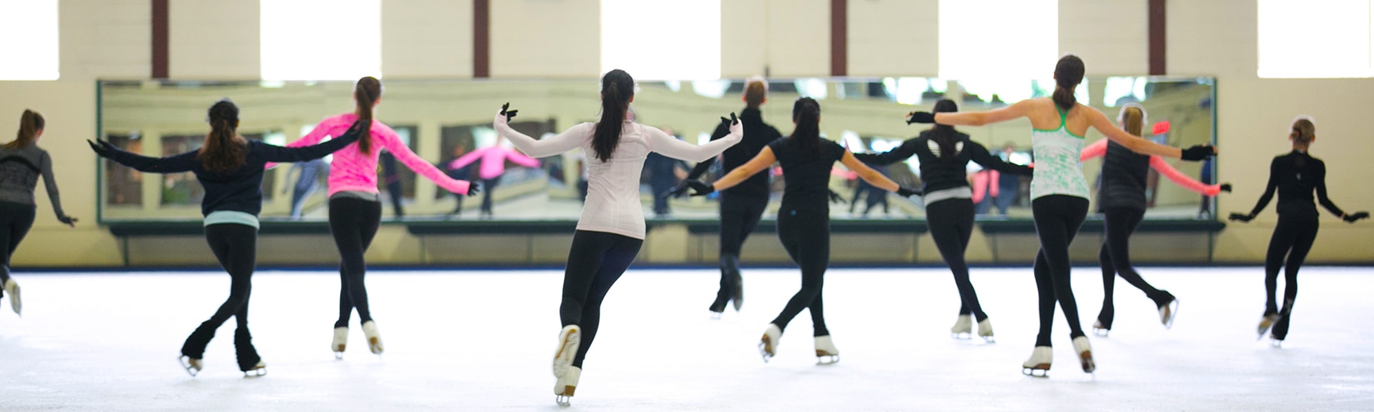 Skaters in a class at the Cricket Club Skating rink