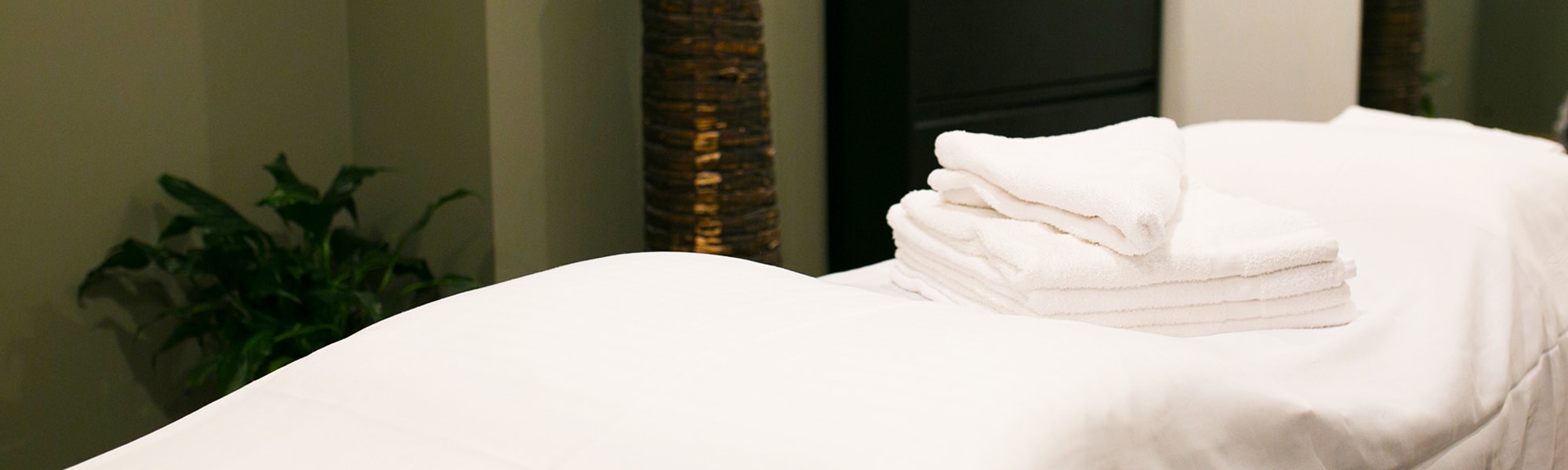 Massage table with towels at the Cricket Club