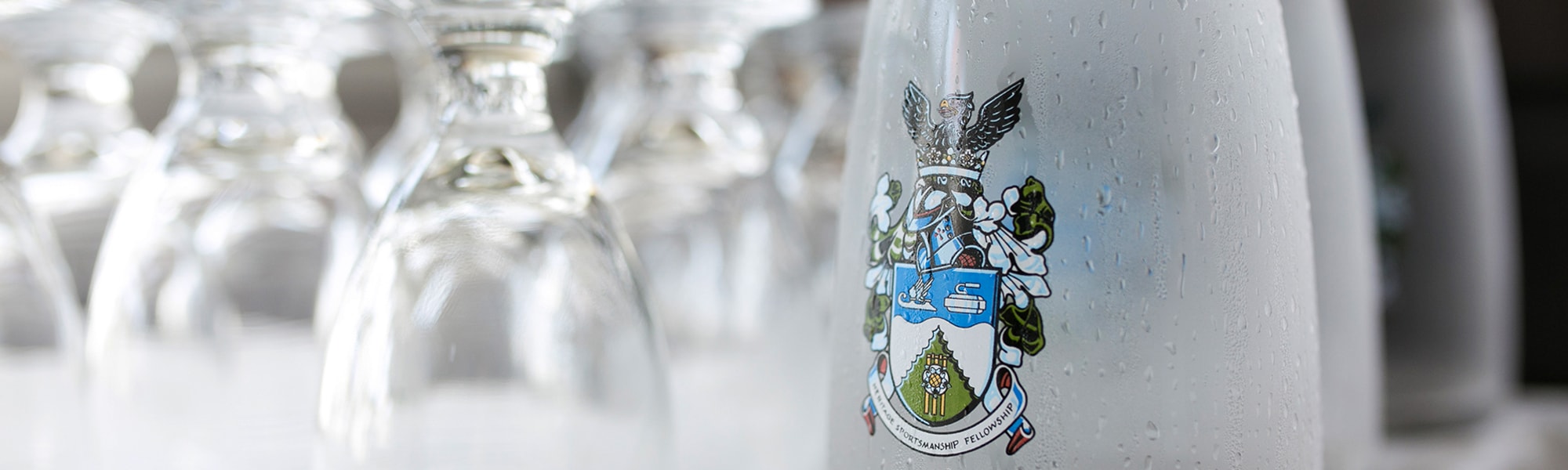 Pitcher of water with the Cricket Club Coat of Arms